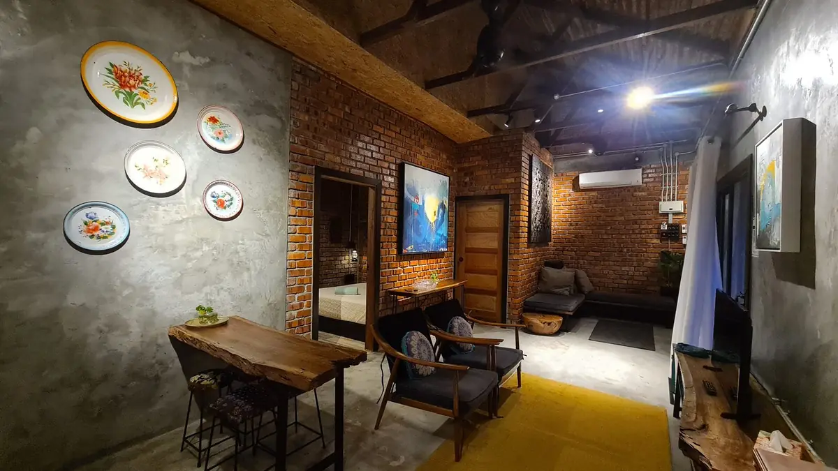 Rumah Opah living room with exposed brick and reclaimed timber