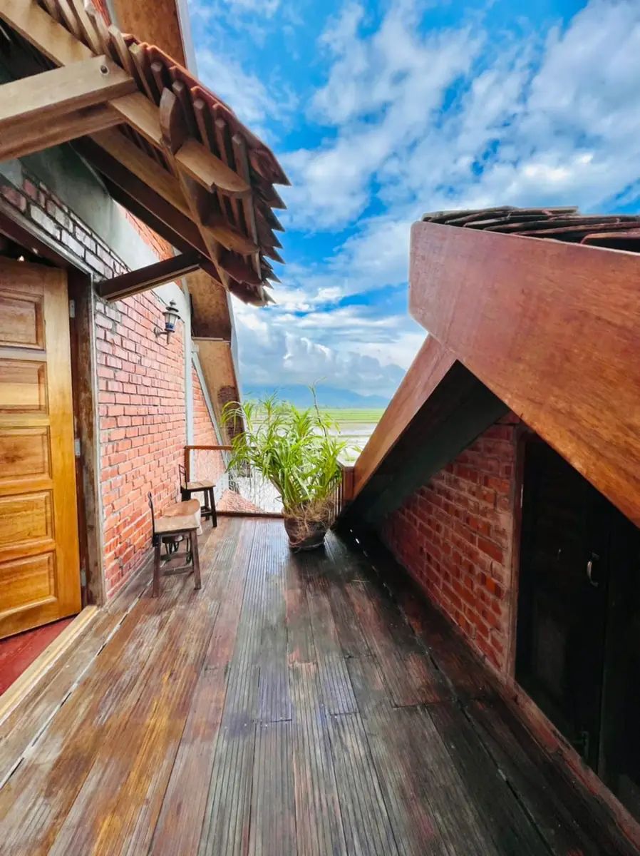 Upstairs balcony deck with a view across the sawah